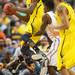 Michigan freshman Caris LeVert eyes sophomore Trey Burke as he saves the ball from going out of bounds on Sunday, March 31, 2013. Melanie Maxwell I AnnArbor.com